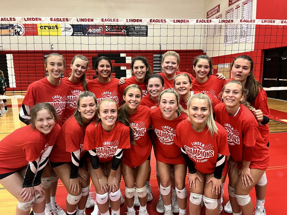 16 Volleyball players in red uniforms