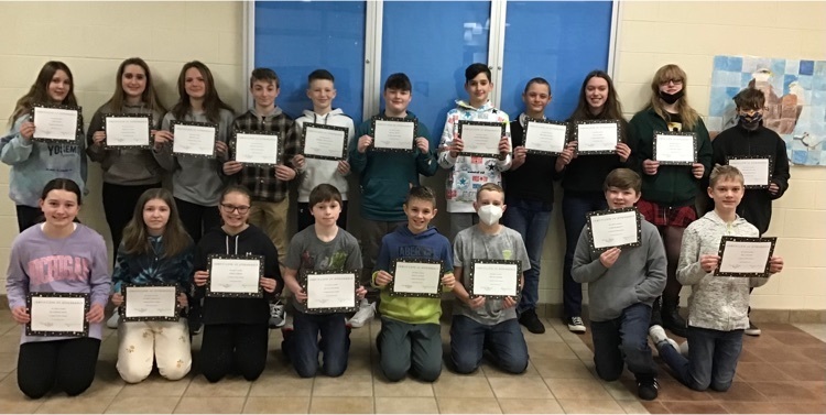 Two rows of students hold certificates 