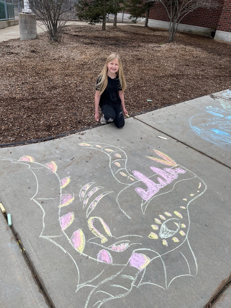 Girl next to sidewalk chalk dragon￼