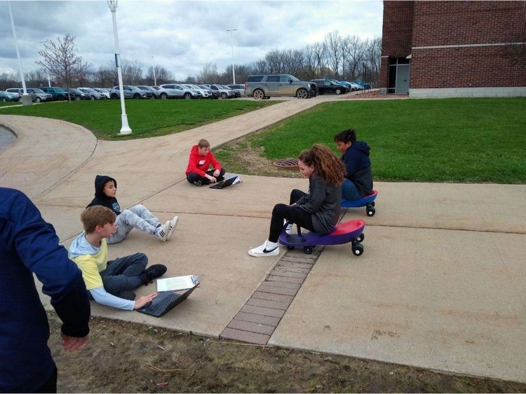 students on scooters