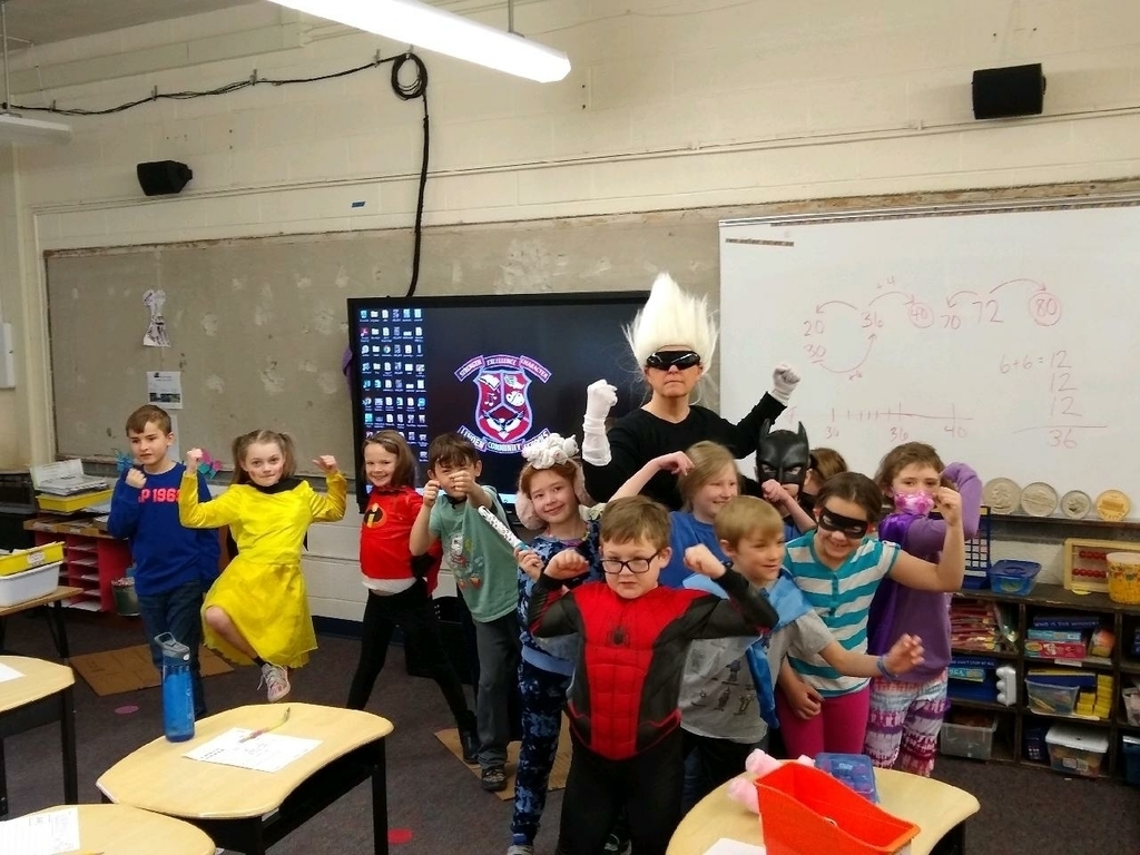 A teacher dressed up as Mr. Freeze with a group of students