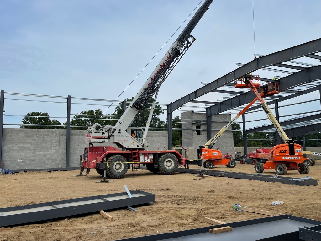 Steel rafters being installed by crane in the multipurpose center