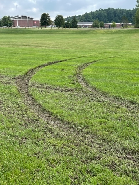 LMS practice field with car tracks through it.