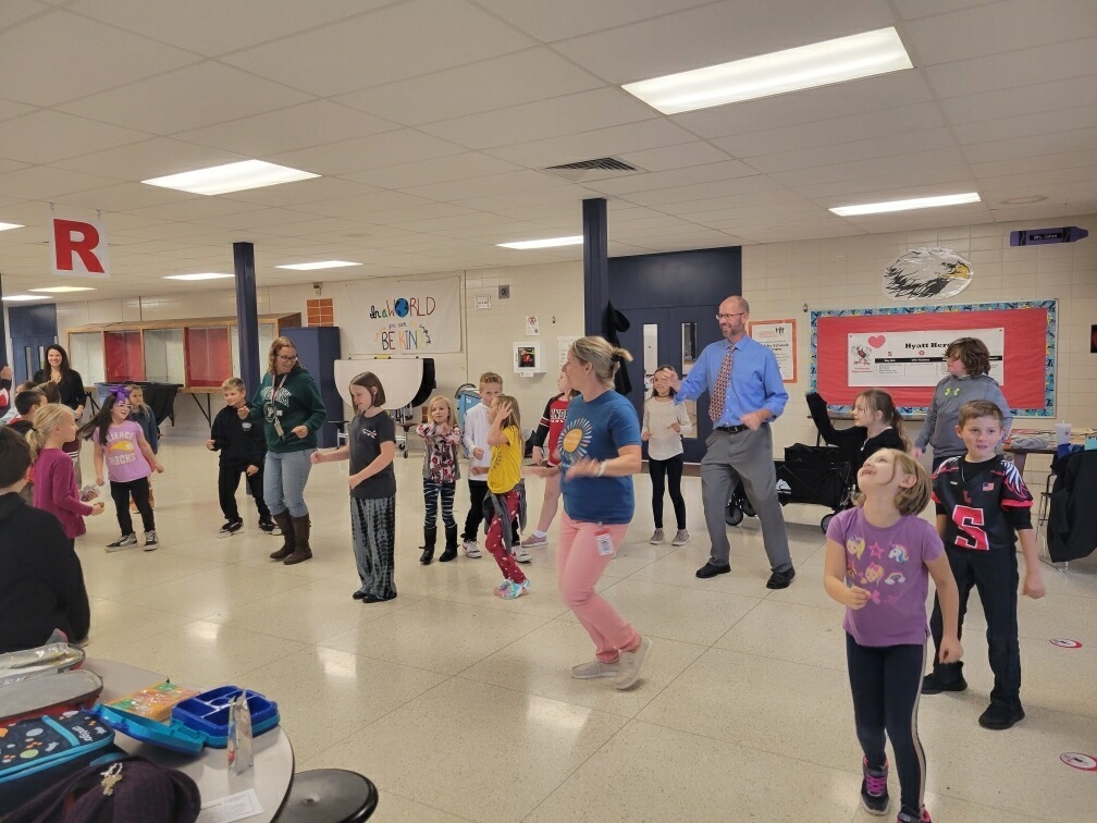 Staff and students dancing to the Cha Cha Slide.
