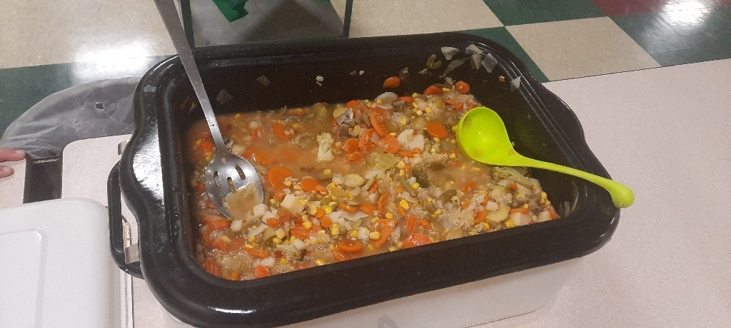 Large pan filled with a variety of vegetables.