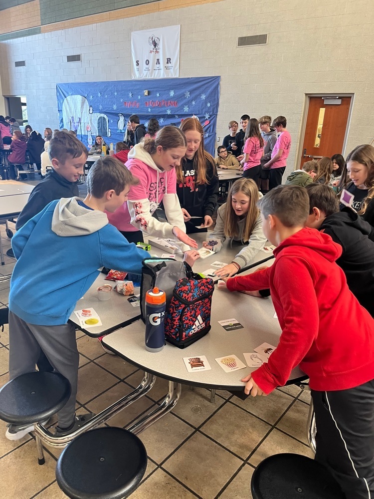 students playing game at a table