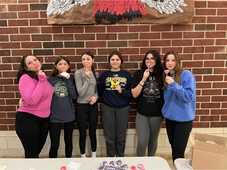 Group of students posing with suckers